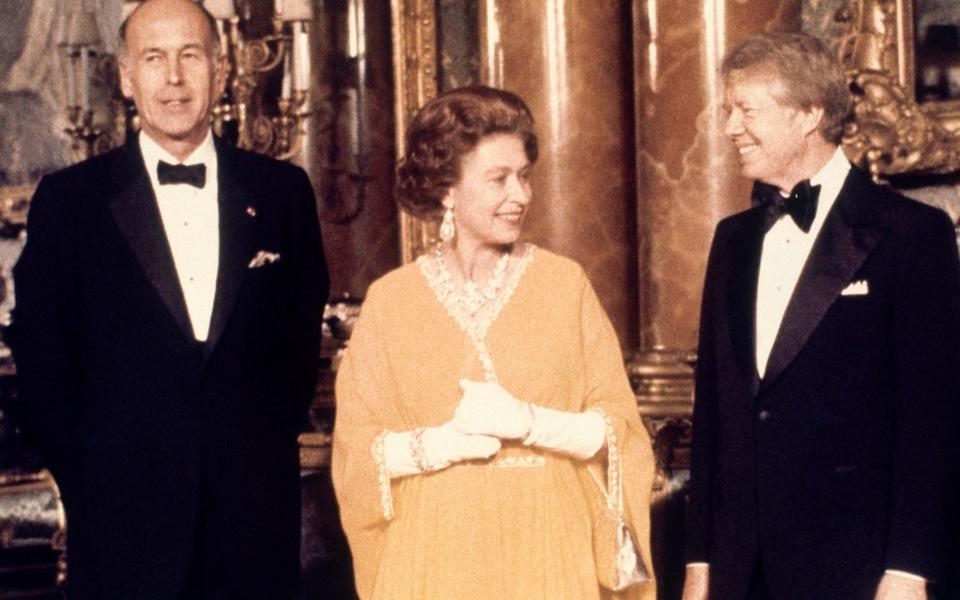 Giscard with the Queen and Jimmy Carter in 1977 - AP