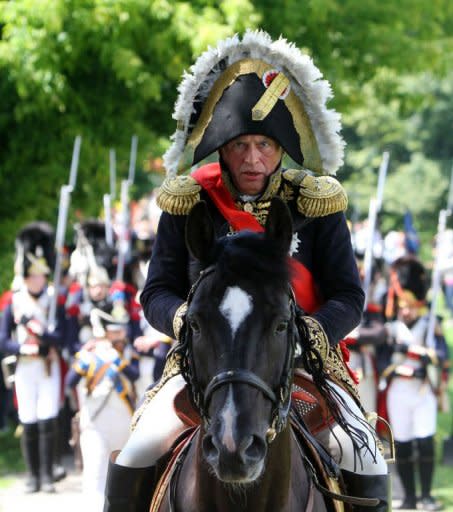 Paris Sorbonne University's professor Oleg Sokolov rides his horse on June 23 on the banks of the river Neman in Kaunas, central Lithuania, as he plays Napoleon Bonaparte during a historical reenactment of Bonaparte's June 24, 1812 assault on Tsarist Russia. The spectacular reenactment drew more than 1,000 participants from France, Russia and across the region