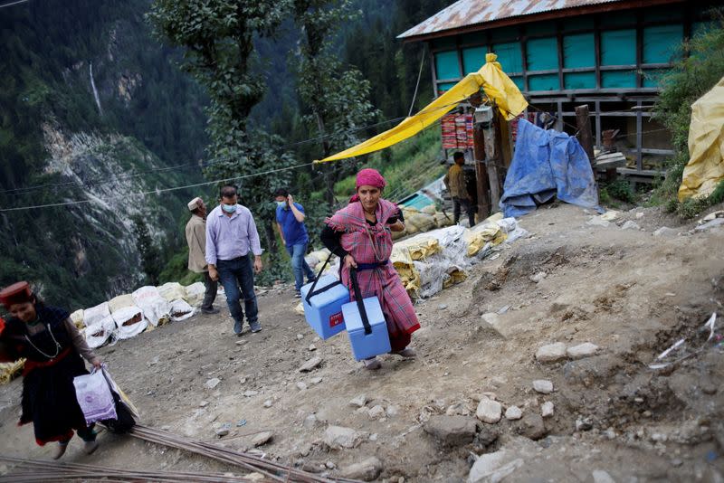 The Wider Image: Doctors scale rockslides, invoke gods to vaccinate Himalayan villages