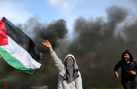 A Palestinian demonstrator shouts during clashes with Israeli troops at a protest against Trump's decision on Jerusalem, near the border with Israel in the southern Gaza Strip March 9, 2018. REUTERS/Ibraheem Abu Mustafa