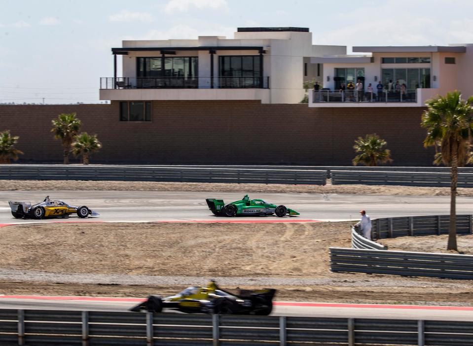 Alex Palou of Chip Ganassi Racing leads Scott McLaughlin of Team Penske through turn three during the feature race of the $1 Million Challenge at The Thermal Club in Thermal, Calif., Sunday, March 24, 2024.