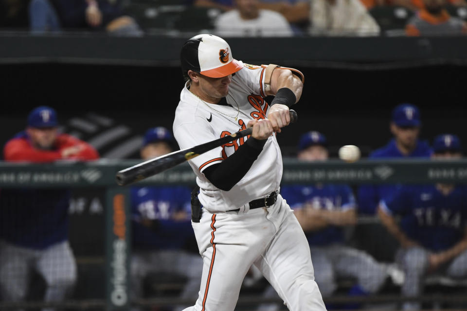 Baltimore Orioles' Austin Hays hits a single in the first inning against Texas Rangers starting pitcher Glenn Otto during a baseball game, Thursday, Sept. 23, 2021, in Baltimore. (AP Photo/Terrance Williams)