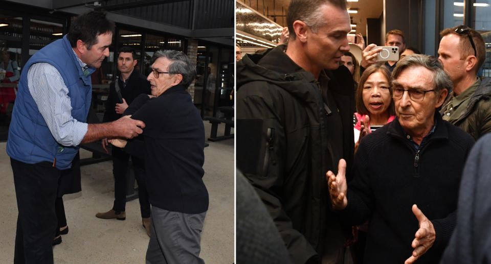 Former Australian diplomat Trevor Sofield is seen with a man holding his arm after trying to approach Scott Morrison.