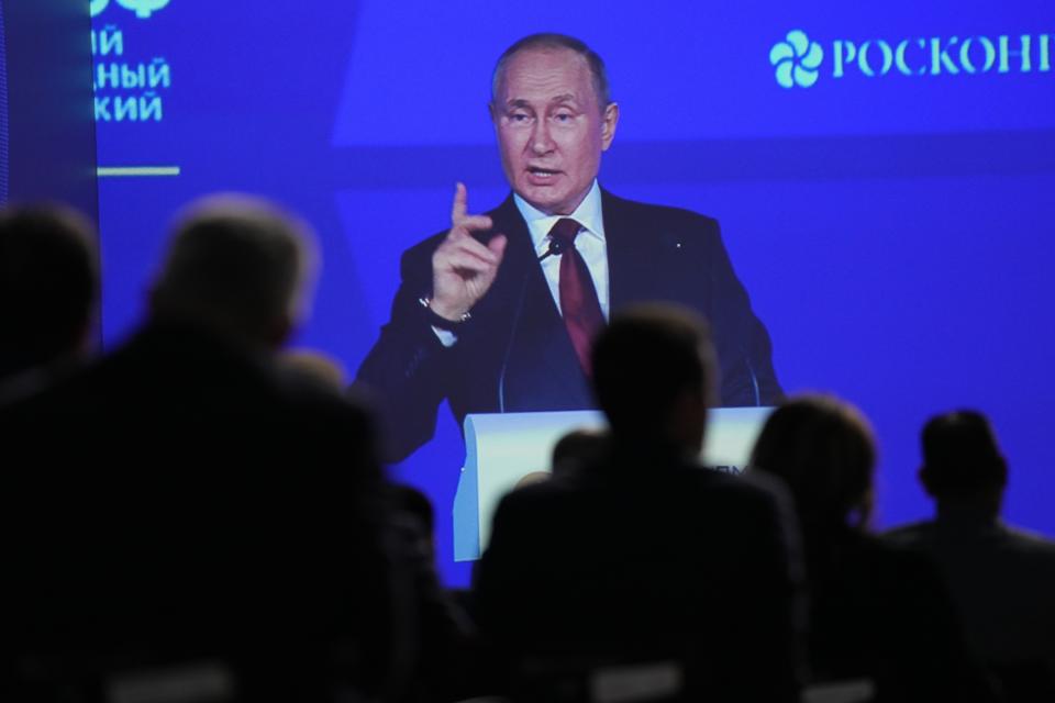 Participants watch as Russian President Vladimir Putin addresses a plenary session of the St. Petersburg International Economic Forum in St. Petersburg, Russia, Friday, June 17, 2022. Putin began his address to the St. Petersburg International Economic Forum with a lengthy denunciation of countries that he contends want to weaken Russia, including the United States who, he said, "declared victory in the Cold war and later came to think of themselves as God's own messengers on planet Earth." (AP Photo/Dmitri Lovetsky)