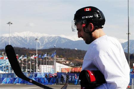 Canada's ice hockey player Patrice Bergeron walks to the Bolshoy arena following a men's team practice at the 2014 Sochi Winter Olympics February 20, 2014. REUTERS/Brian Snyder