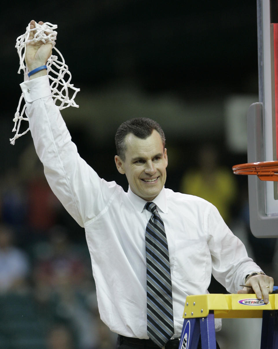 FILE - Florida coach Billy Donovan cuts down the net after his Gators defeated Ohio State 84-75 in the Final Four national basketball championship game at Georgia Dome in Atlanta, April 2, 2007. Billy Donovan hasn’t watched many UConn games. But the Chicago Bulls coach has seen enough to know the Huskies’ bid to repeat as national champions is happening in “a totally different environment.” (AP Photo/Mark Humphrey, file)