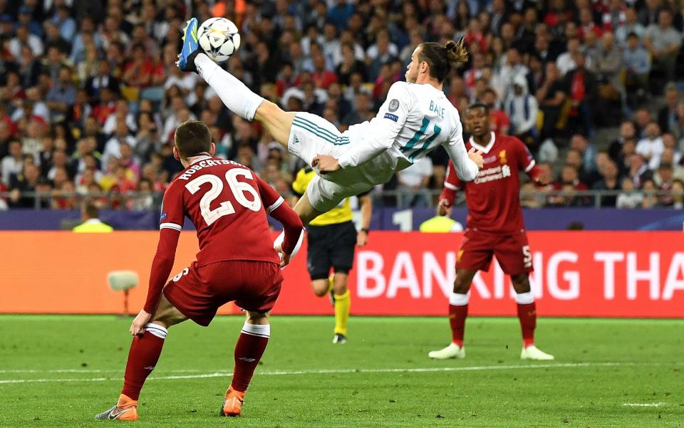 Gareth Bale of Real Madrid shoots and scores his side's second goal during the UEFA Champions League Final between Real Madrid and Liverpool at NSC Olimpiyskiy Stadium  - David Ramos/Getty Images