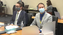 In this image from video, defense attorney Eric Nelson, left, and defendant, former Minneapolis police officer Derek Chauvin listen to Hennepin County Judge Peter Cahill read instructions to the jury before closing arguments, Monday, April 19, 2021, in the trial of Chauvin at the Hennepin County Courthouse in Minneapolis. Chauvin is charged in the May 25, 2020 death of George Floyd. (Court TV via AP, Pool)