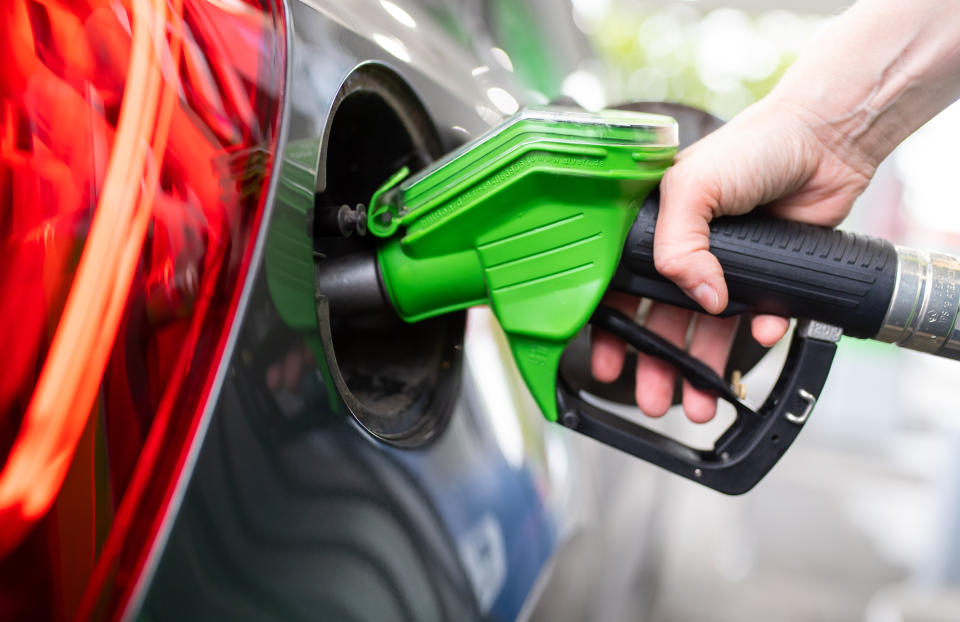 06 September 2020, Bavaria, Munich: A woman holds a pump nozzle in her hand at a gas station and refuels a car. Photo: Sven Hoppe/dpa (Photo by Sven Hoppe/picture alliance via Getty Images)