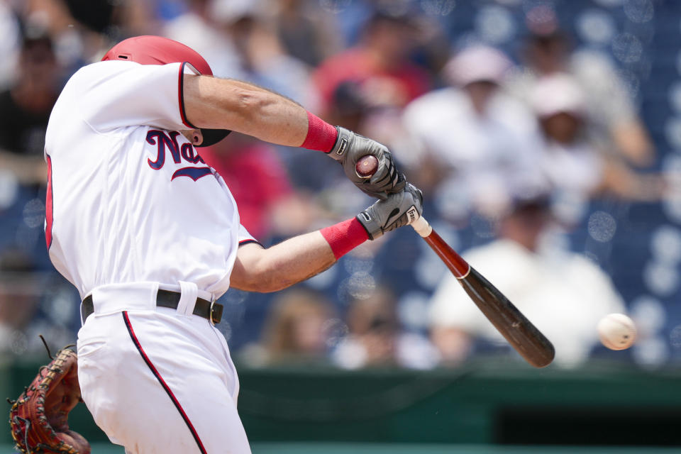 Washington Nationals' Jake Alu hits an RBI single during the third inning of a baseball game against the Milwaukee Brewers at Nationals Park, Wednesday, Aug. 2, 2023, in Washington. (AP Photo/Alex Brandon)