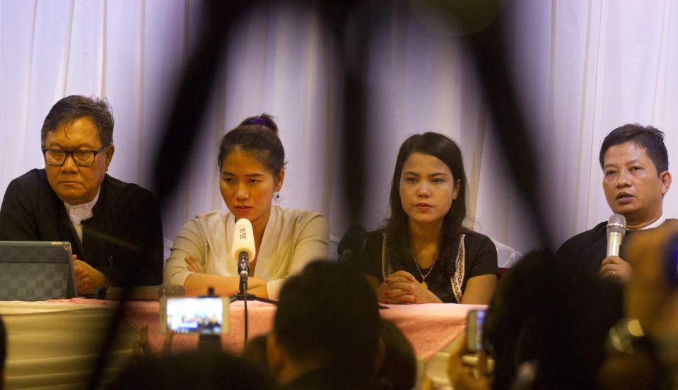 Than Zaw Aung, right, a lawyer of two Reuters journalists, talks to journalists during a press briefing together with Pan Ei Mon, second left, wife of Reuters journalist Wa Lone, Chit Su Win, second right, wife of Reuters journalist Kyaw Soe Oo, and Khin Maung Zaw, left, a lawyer of two Reuters journalists, at a hotel Tuesday, Sept. 4, 2018, in Yangon, Myanmar. A Myanmar court sentenced two Reuters journalists to seven years in prison Monday on charges of illegal possession of official documents, a ruling met with international condemnation that will add to outrage over the military’s human rights abuses against Rohingya Muslims. (AP Photo/Thein Zaw)