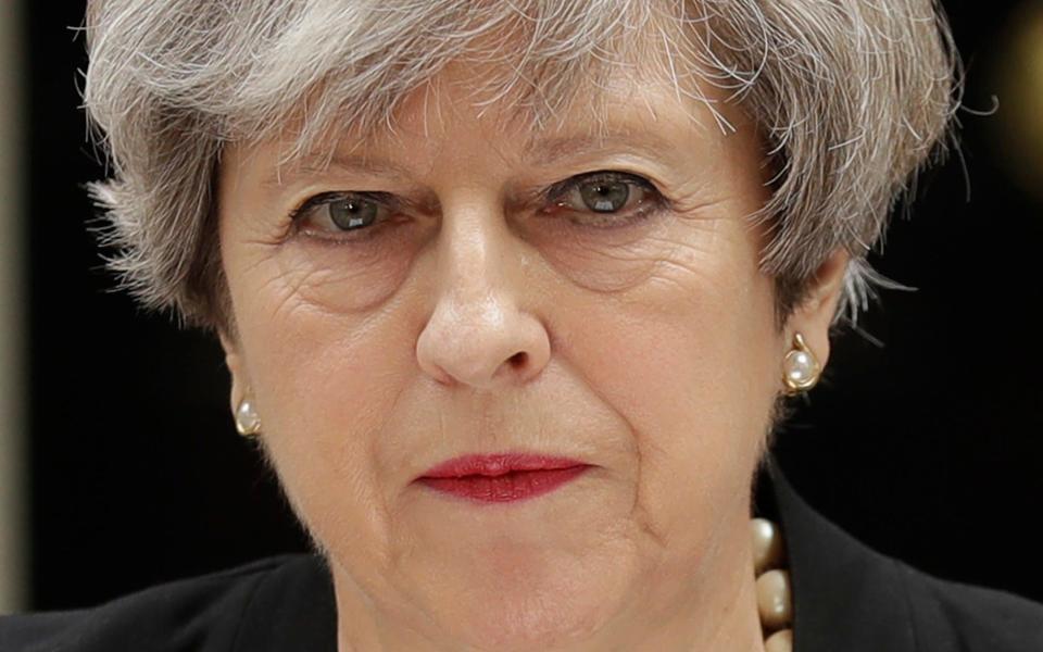 Theresa May addresses the media outside 10 Downing Street on Tuesday after the Manchester terror attack - AP