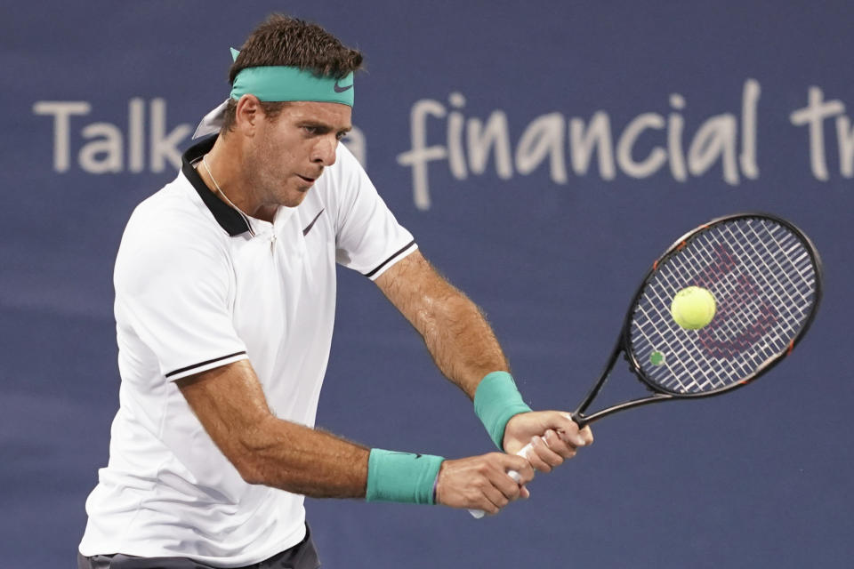 Juan Martin del Potro, of Argentina, returns to David Goffin, of Belgium, at the Western & Southern Open tennis tournament, Friday, Aug. 17, 2018, in Mason, Ohio. (AP Photo/John Minchillo)