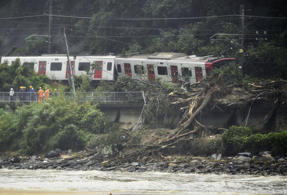 <p>A train remains derailed by a landslide caused by heave rains in Karatsu, Saga prefecture, southwestern Japan, Saturday, July 7, 2018. (Photo: Tsuyoshi Ueda/Kyodo News via AP) </p>