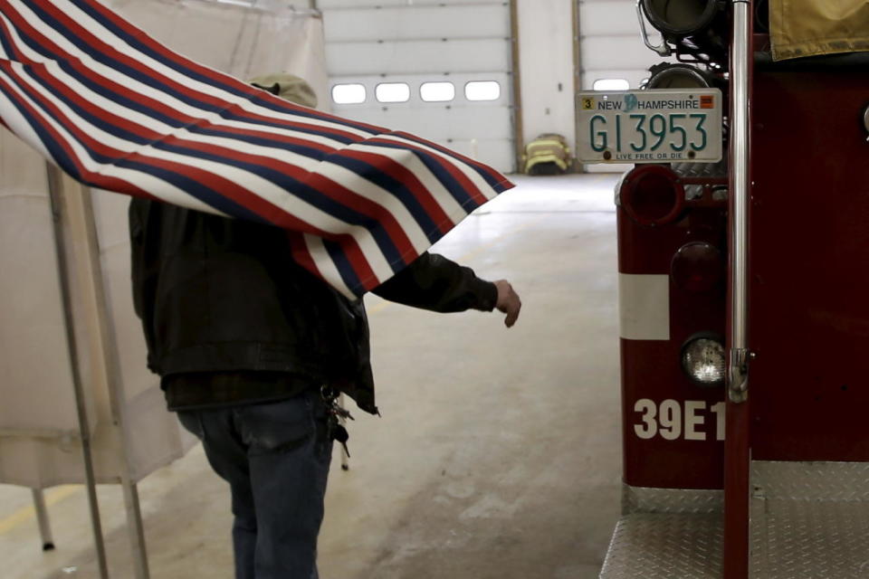 A voter exits a voting booth in Stark