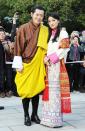 <p>King Jigme Khesar Namgyel Wangchuck, 40, and his wife Jetsun Pema, 29, first met when she was just 7 years old at a picnic. Although Jetsun Pema is considered a commoner, her family has many connections with the royal family and it’s said that at the picnic, she <a href="http://www.worldofbuzz.com/real-life-cinderella-story/" rel="nofollow noopener" target="_blank" data-ylk="slk:innocently confessed her love;elm:context_link;itc:0;sec:content-canvas" class="link ">innocently confessed her love</a> for the dashing prince. Her childish confession caught the prince’s heart and he promised that when she grew up and if they were both single and in love, he would marry her. The two later married in 2011, and gave birth to a son in 2016.</p>