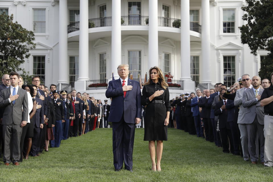 President Donald Trump and first lady Melania Trump participate in a moment of silence honoring the victims of the Sept. 11 terrorist attacks, on the South Lawn of the White House, Wednesday, Sept. 11, 2019, in Washington. (AP Photo/Evan Vucci)