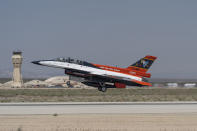 The X-62A VISTA aircraft, an experimental AI-enabled Air Force F-16 fighter jet, takes off on Thursday, May 2, 2024, at Edwards Air Force Base, Calif. The flight, with Air Force Secretary Frank Kendall riding in the front seat, is serving as a public statement of confidence in the future role of AI in air combat. The military is planning to use the technology to operate an unmanned fleet of 1,000 aircraft. (AP Photo/Damian Dovarganes)