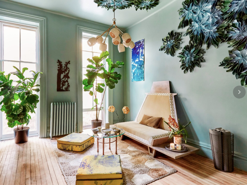 living room ideas, light green living room with greenery installation on the ceiling