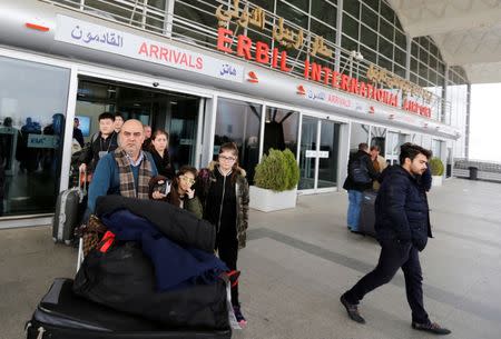 Fuad Sharef Suleman and his family push their luggages after returning from Cairo to Erbil, after U.S. President Donald Trump's decision to temporarily bar travellers from seven countries, including Iraq, at Erbil International Airport, Iraq, January 29, 2017. REUTERS/Ahmed Saad