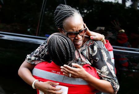 An unidentified woman reacts outside the scene where explosions and gunshots were heard at the Dusit hotel compound, in Nairobi, Kenya January 16, 2019. REUTERS/Thomas Mukoya