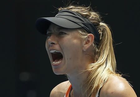 Russia's Maria Sharapova reacts during her quarter-final match against Serena Williams of the U.S. at the Australian Open tennis tournament at Melbourne Park, Australia, January 26, 2016. REUTERS/Issei Kato