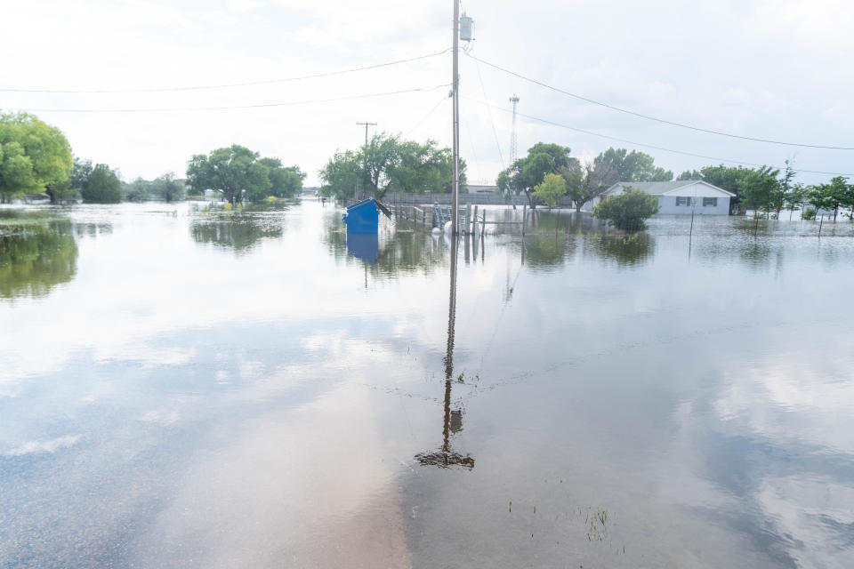 A flooded house is seen in June on 77th Street near Amarillo across from the Greenways.