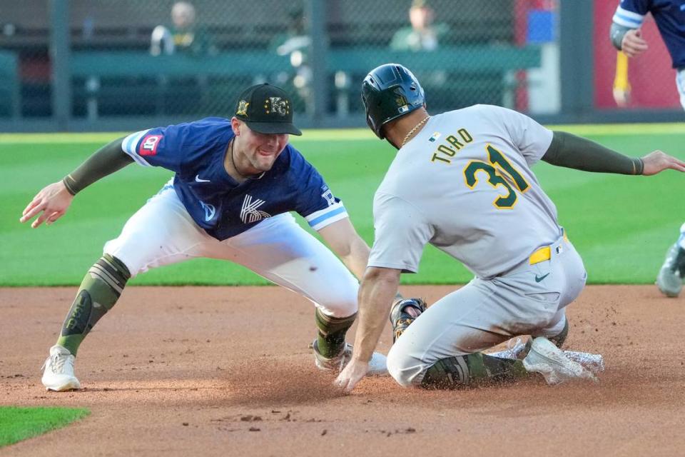 Kansas City Royals shortstop Bobby Witt Jr. tags out Oakland Athletics left fielder Abraham Toro, who was attempting to steal second base during the opening inning of Friday night’s game Kauffman Stadium.