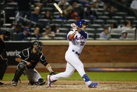 FILE PHOTO: May 11, 2019; New York City, NY, USA; New York Mets right fielder Michael Conforto (30) hits a single in the fourth inning against the Miami Marlins at Citi Field. Noah K. Murray-USA TODAY Sports