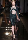 Versace AW13 Couture: This bottle green velvet dress featured a revealing cut-out.