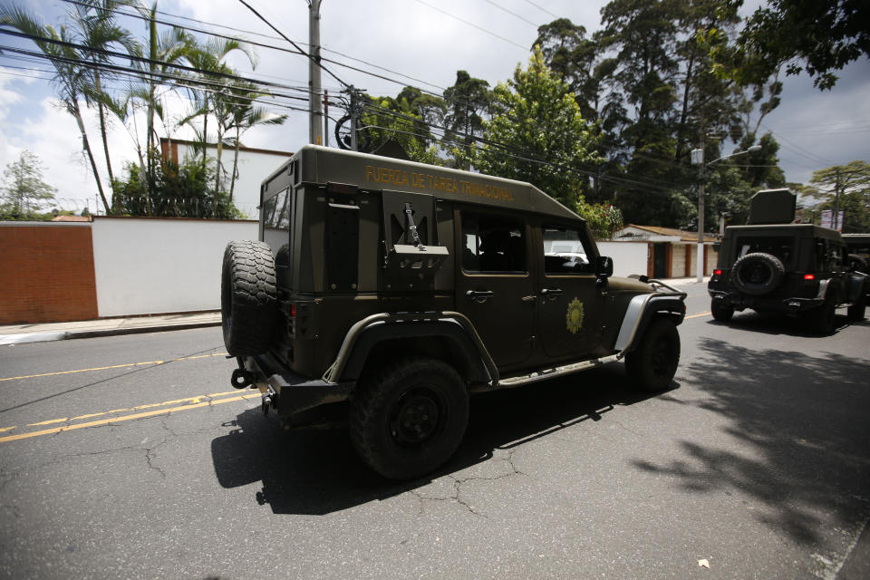 An armed army vehicle patrols in front of the United Nations International Commission Against Impunity, CICIG, headquarters in Guatemala City, Friday, Aug. 31, 2018. Guatemala president Jimmy Morales says he is not renewing mandate of U.N.-sponsored commission investigating corruption in the country.( AP Photo)