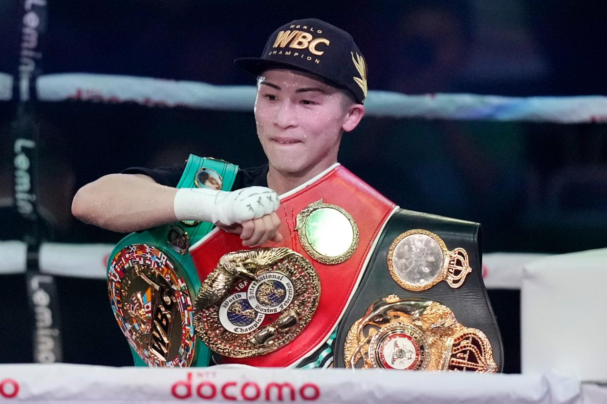 Naoya Inoue celebrates becoming undisputed champion in a second division in December (AP)