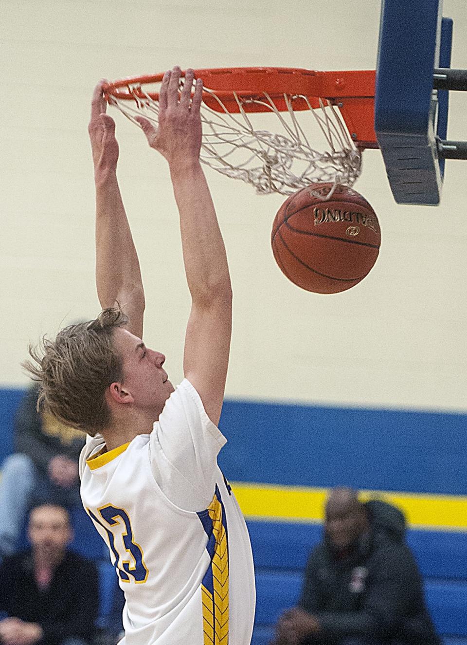 Assabet's Jeff Hunter, pictured dunking the ball in the Aztecs' 90-42 win over Keefe Tech in the regular season, had a monster slam in Assabet's playoff win on Friday night. [Daily News and Wicked Local Staff File Photo/Art Illman]