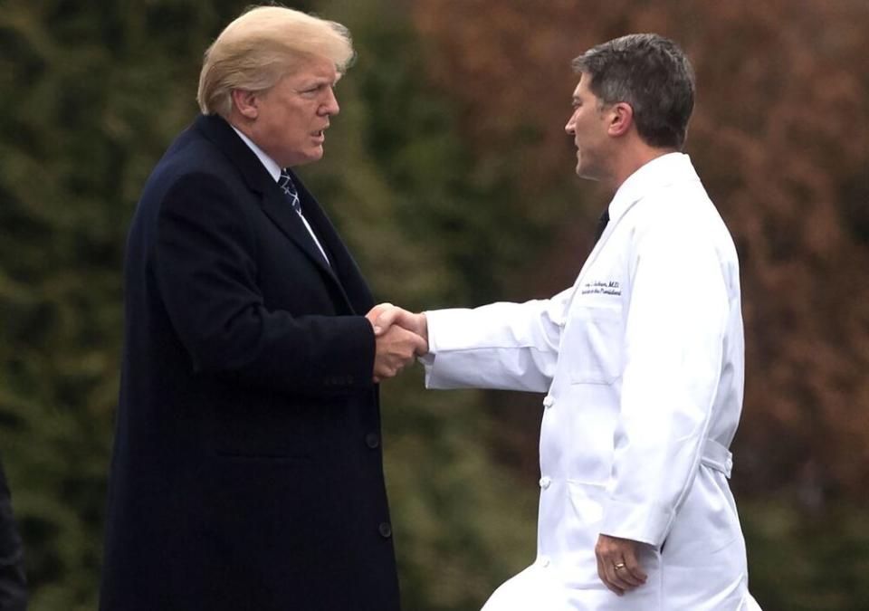 President Donald Trump (left) shakes the hand of former White House physician Ronny Jackson in January 2018 | SAUL LOEB/AFP via Getty