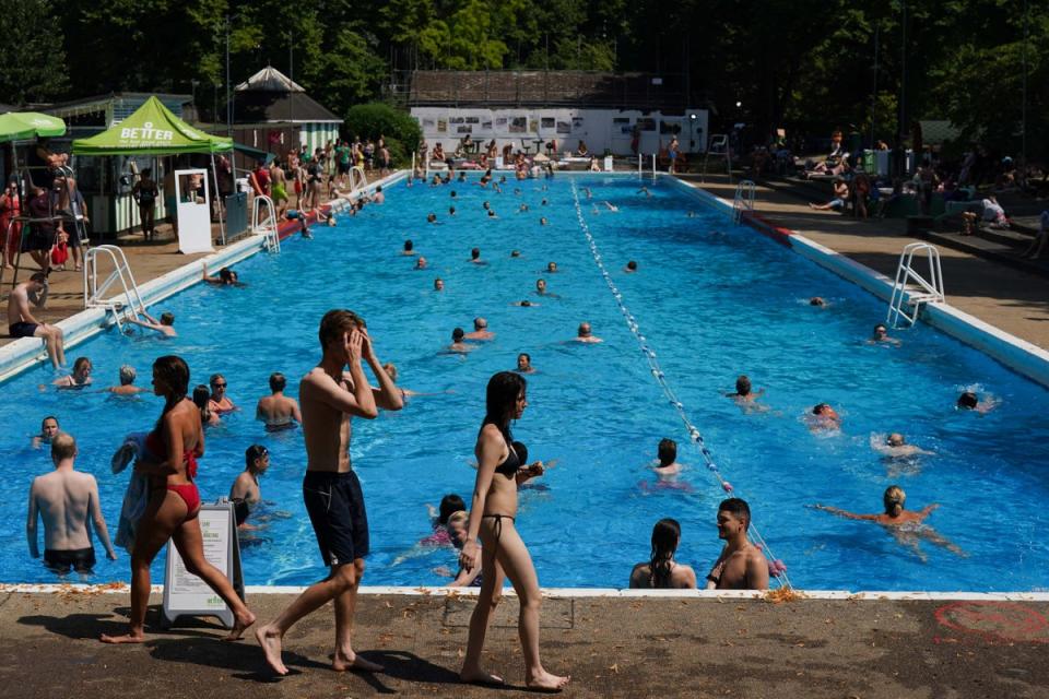 People enjoy the hot weather at Jesus Green Lido in Cambridge (PA Wire)