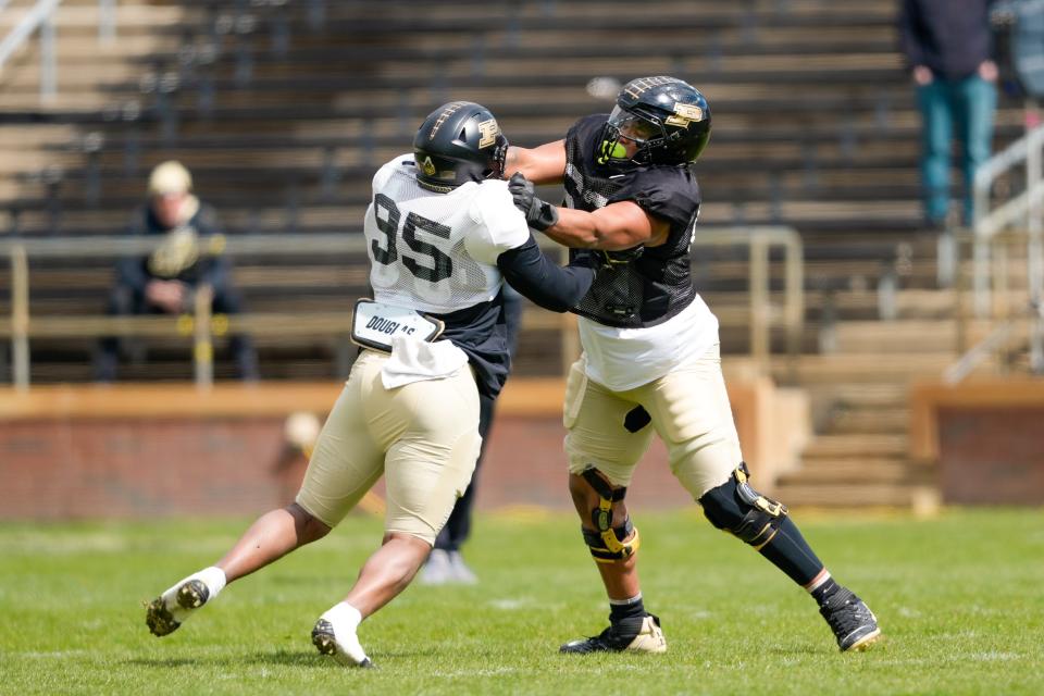 Purdue offensive lineman Marcus Mbow (63) blocks Joe Anderson (95) during the spring game, Saturday, April 9, 2022 at Ross-Ade Stadium in West Lafayette.