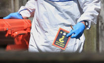 <p>Police forensic investigators search the property of Salmon Abedi England, Tuesday, May 23, 2017. Official records show that Salmon Abedi was registered as living at the Manchester house raided by armed police investigating Monday night’s deadly concert blast. The electoral register shows that Abedi – named by U.S. officials as the suspect in the suicide bombing at an Ariana Grande concert – lived at the house in Fallowfield in southern Manchester where police carried out a controlled explosion Tuesday. (Danny Lawson/PA via AP) </p>