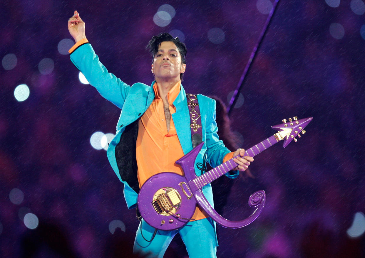 FILE - In this Feb. 4, 2007, file photo, Prince performs during the halftime show at the Super Bowl XLI football game in Miami. The saga to settle Prince's estate provides a cautionary tale about what can happen when someone dies without leaving a will, as he did when he died of an accidental opioid overdose at his Paisley Park studio April 21, 2016. (AP Photo/Chris O'Meara, File)