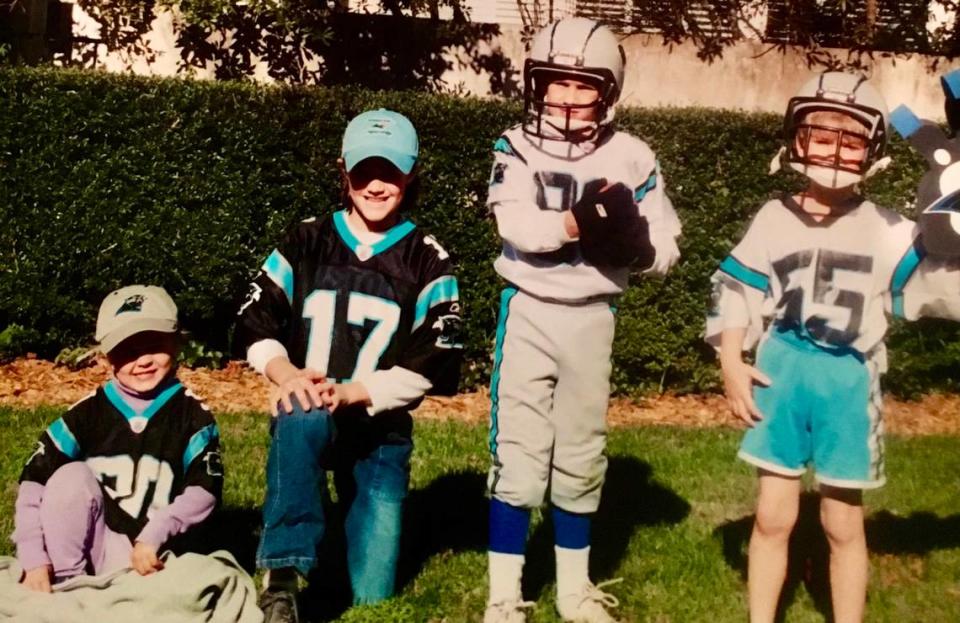 The four Jones children dressed in their Panther jerseys. All four of the kids grew up in Charlotte, starred in sports at Charlotte Latin and went on to become college scholarship athletes. From left to right: Ruthie, Becca, Daniel (now the N.Y. Giants quarterback) and Bates.