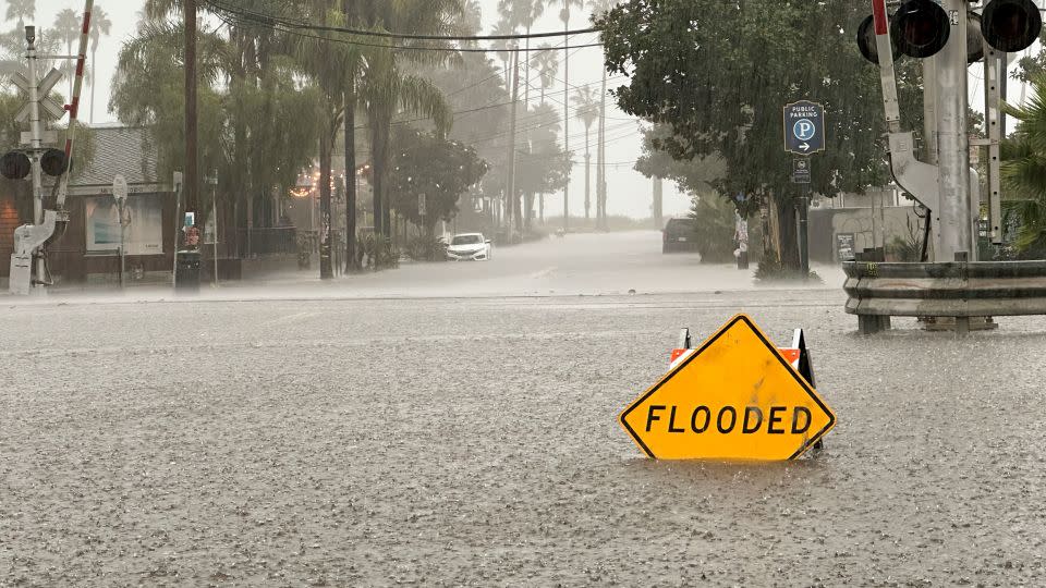 A street floods as rain comes down on Thursday in Santa Barbara, California. - Eugene Garcia/AP