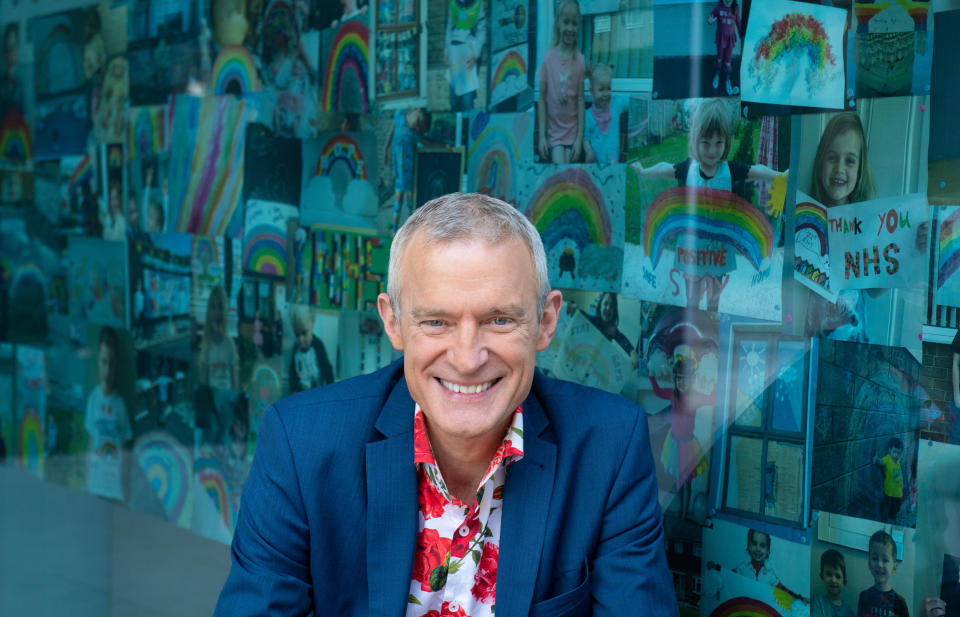 Jeremy Vine with rainbow pictures sent in by viewers of his Channel 5 show, on display in the windows of the ITN building, in central London, in tribute to the key workers battling the coronavirus outbreak. (Photo by Dominic Lipinski/PA Images via Getty Images)