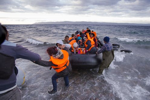 <span class="caption">Asylum seekers arriving on the Greek island Lesvos in 2015.</span> <span class="attribution"><a class="link " href="https://www.shutterstock.com/image-photo/lesvos-island-greece-29-october-2015-519491944" rel="nofollow noopener" target="_blank" data-ylk="slk:Nicolas Economou/Shutterstock;elm:context_link;itc:0;sec:content-canvas">Nicolas Economou/Shutterstock</a></span>