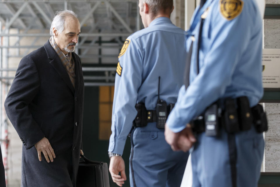 Syrian chief negotiator Bashar Jaafari, Ambassador of the Permanent Representative Mission of Syria to the UN in New York, left, arrives for a meeting during the second round of negotiations between the Syrian government and the opposition at the European headquarters of the United Nations, in Geneva, Switzerland, Saturday, Feb. 15, 2014. (AP Photo/Keystone, Salvatore Di Nolfi)