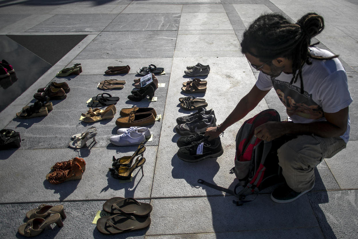 A demonstrator places an empty pair of shoes outside the Capitol building in San Juan, Puerto Rico, during a June 1, 2018, protest against the government's reporting of the death toll from Hurricane Maria. (Bloomberg via Getty Images)
