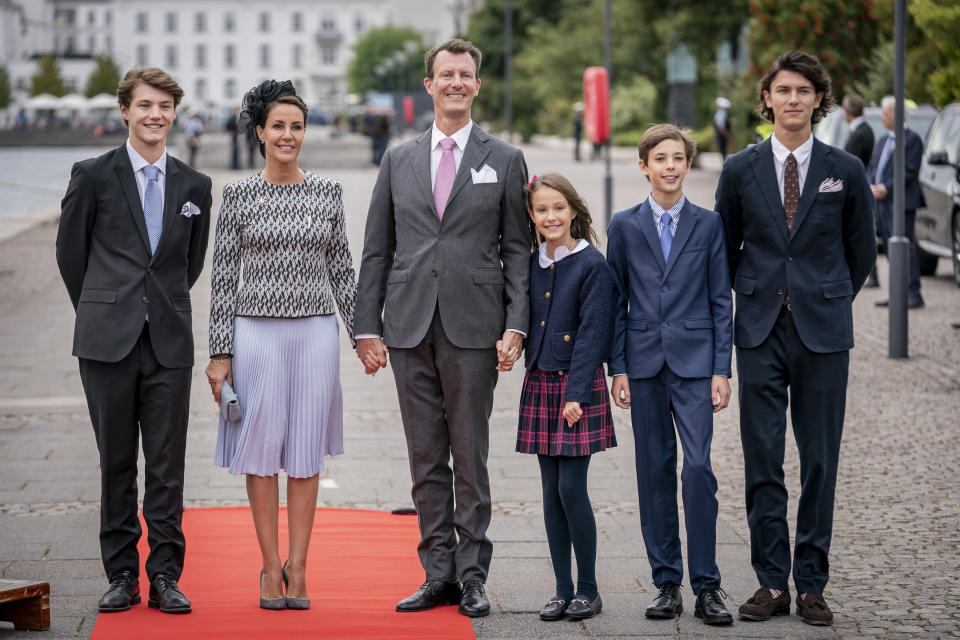 FILE - Prince Felix, Princess Marie, Prince Joachim, Princess Athena, Prince Henrik and Prince Nikolai pose for a photo prior to luncheon on the Royal Yacht Dannebrog to mark the 50th anniversary of Danish Queen Margrethe II's accession to the throne, in Copenhagen, Denmark, Sunday, Sept. 11, 2022. While Margrethe’s reign has been largely free of scandal, she stirred uproar inside the family in 2022 when she stripped Joachim’s four children of their royal titles. Her decision was in line with other European royal houses and in keeping with the times. Joachim said he was saddened. Margrethe later apologized but stood by her decision. (Mads Claus Rasmussen/Ritzau Scanpix via AP, File)