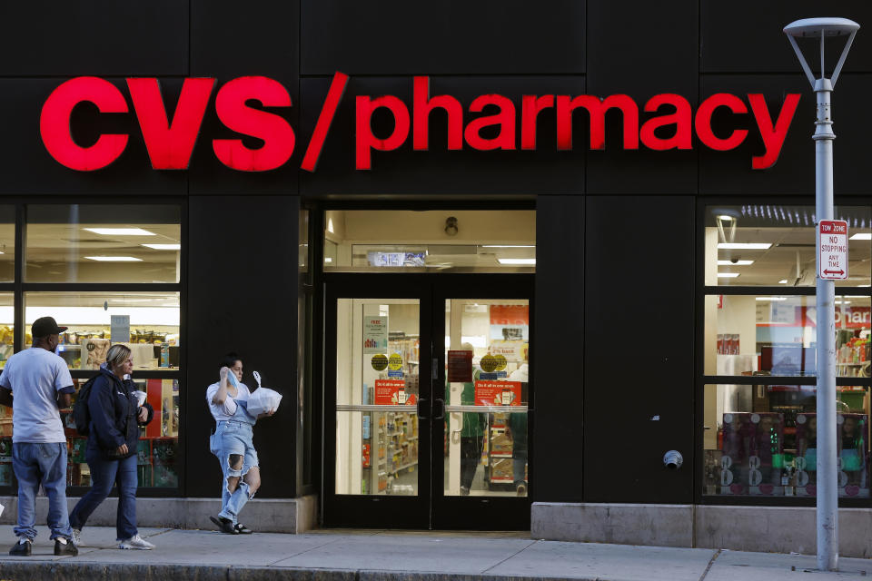 FILE - Customers walk to a CVS Pharmacy, Friday, Nov 4, 2022, in Boston. Don't count on a favorite store being open on Easter Sunday. Several stores will be closed March 31, 2024, in observance of the holiday. (AP Photo/Michael Dwyer, FIle)