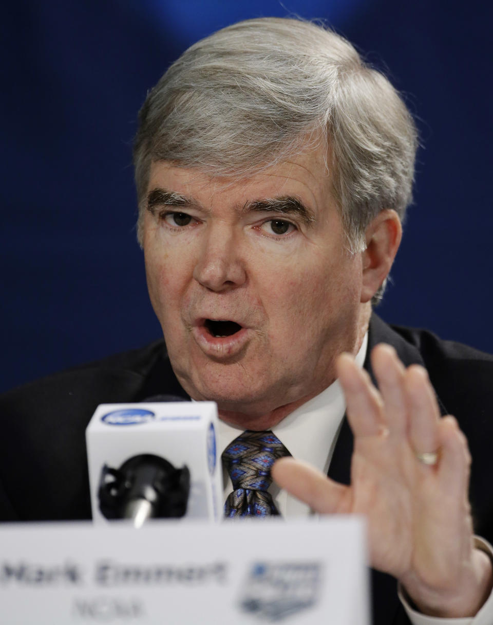 NCAA President Mark Emmert answers a question at a news conference Sunday, April 6, 2014, in Arlington, Texas. (AP Photo/David J. Phillip)