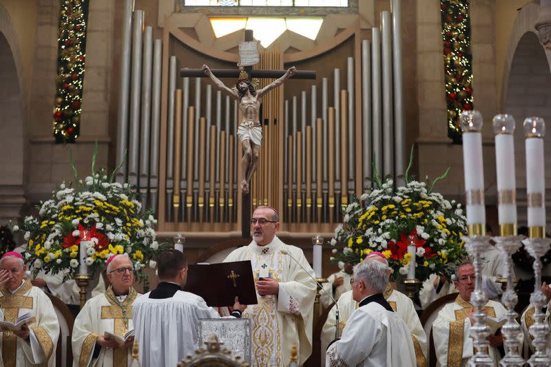 Worshippers attend Christmas morning mass as COVID-19 subdues festivities in Bethlehem