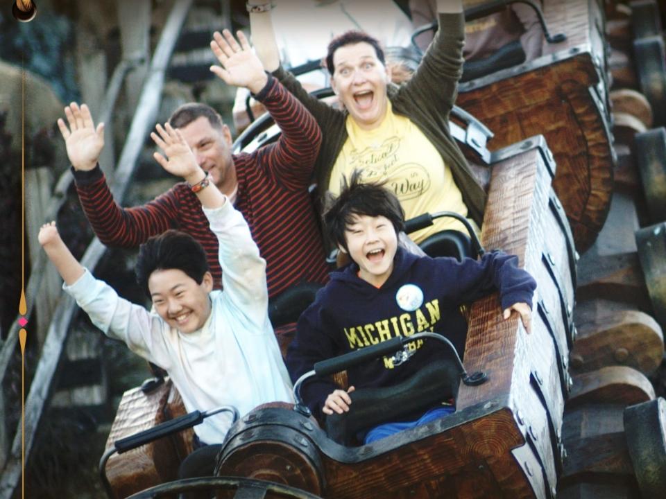 jill and her family riding seven dwarfs mine train at disney world