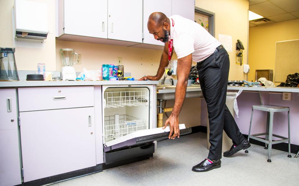 Kareem Neal, the 2019 Arizona Teacher of the Year, shows a dishwasher that was purchased with school funds but is now broken with no funds to replace it in his classroom, Monday, April 22, 2019. A lack of funding for supplies has forced many teachers to bring their own supplies or reach out to websites such as DonorsChoose.org to fulfill classroom needs.